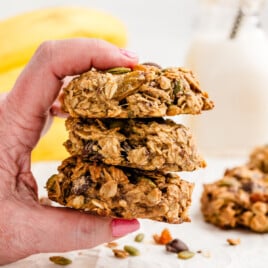 a hand holding three Breakfast Cookies
