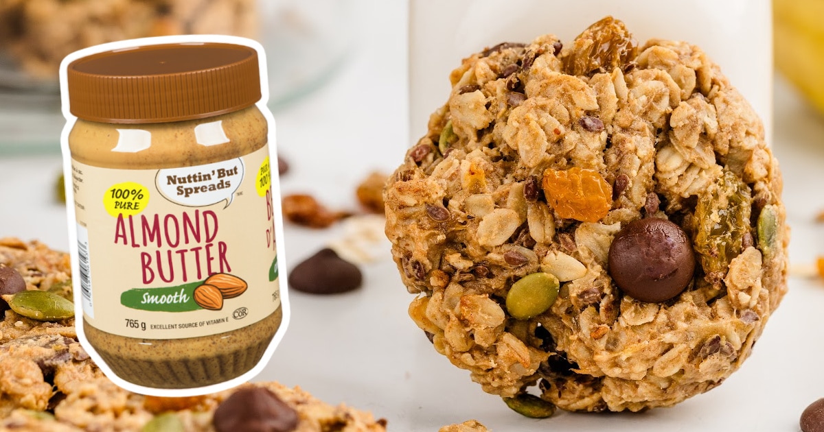 a Breakfast Cookie with a jar of almond butter on the side