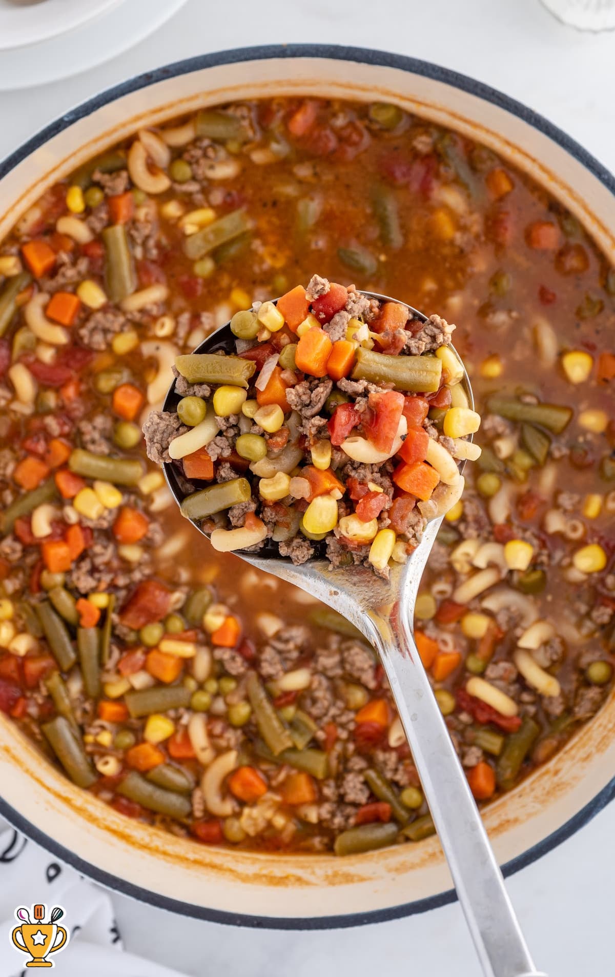 Busy Day Soup in a pot, with a spoon holding some