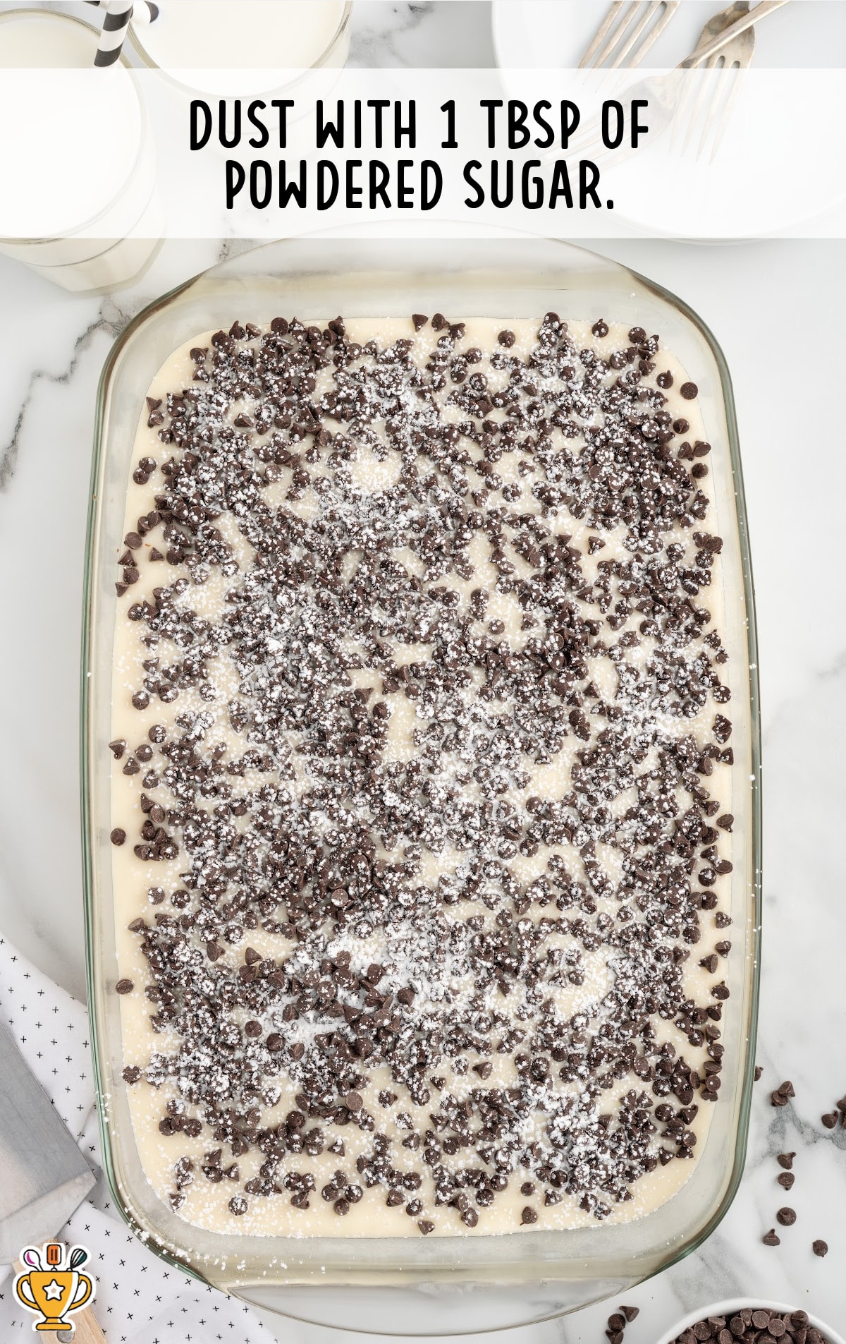 powdered sugar dusted over the cake in a baking dish