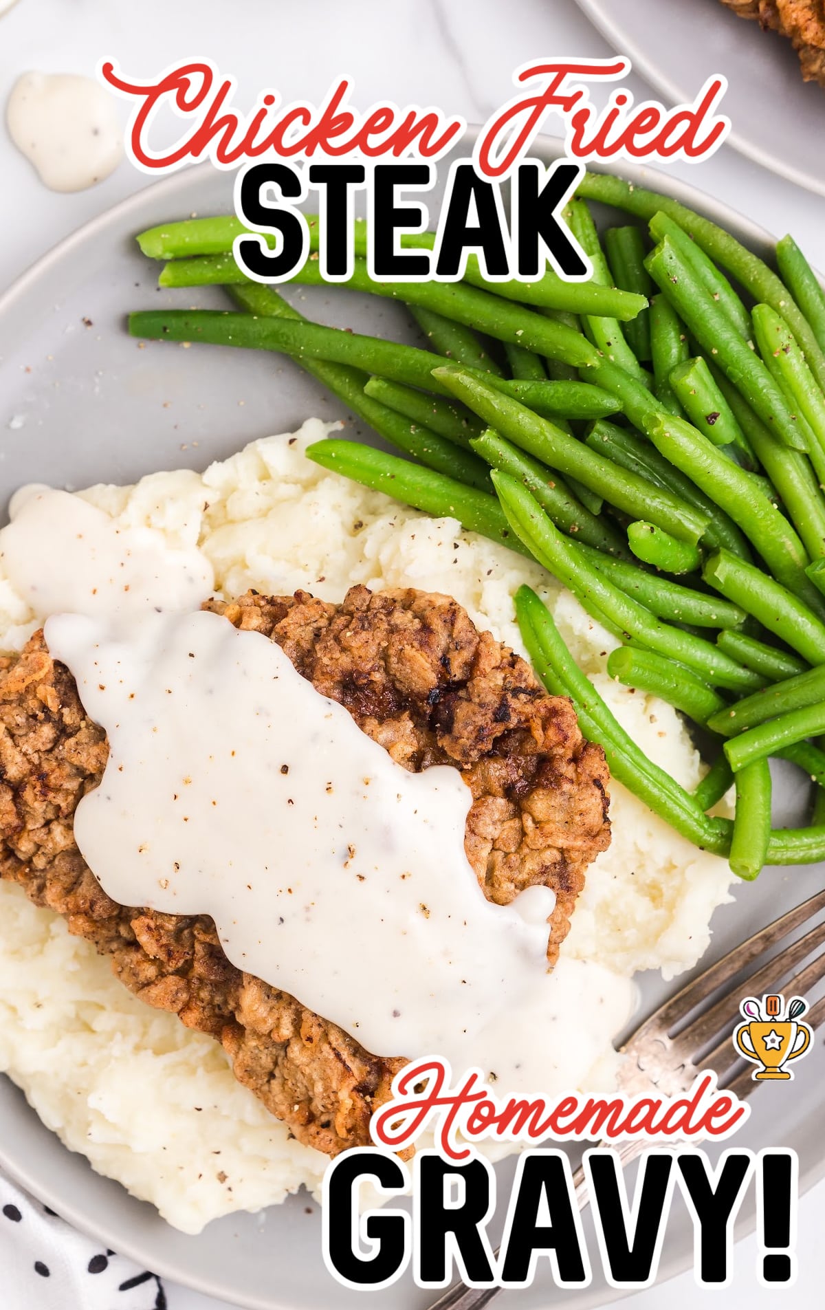 Chicken Fried Steak on a plate with green beans