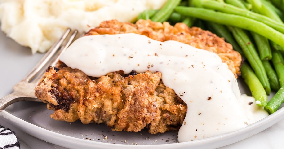 Chicken Fried Steak on a plate with a fork