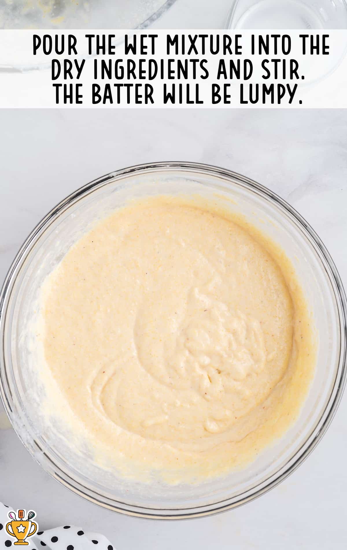 wet mixture poured into the dry ingredients in a bowl