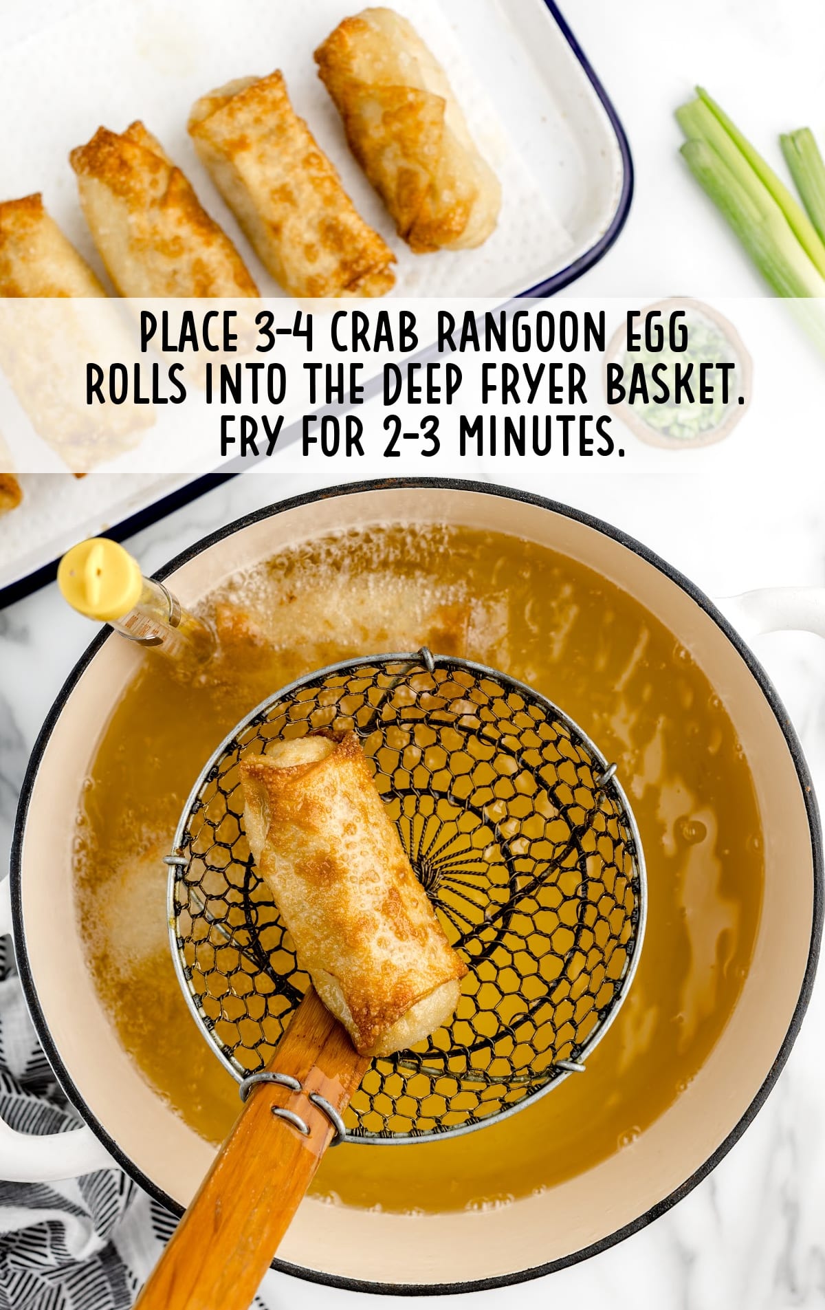 Crab Rangoon Eggroll placed into the deep fryer basket