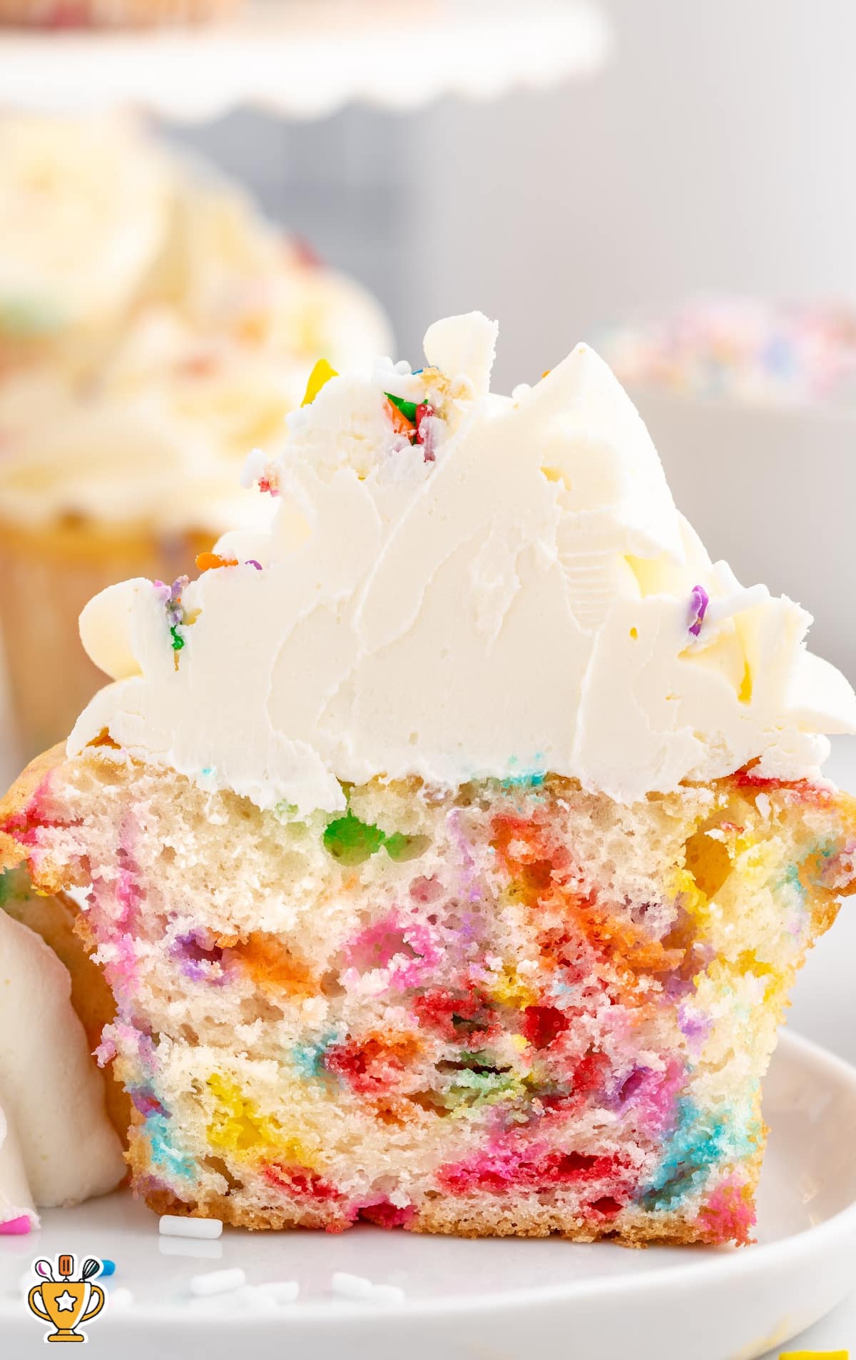 a half Funfetti Cupcake on a plate