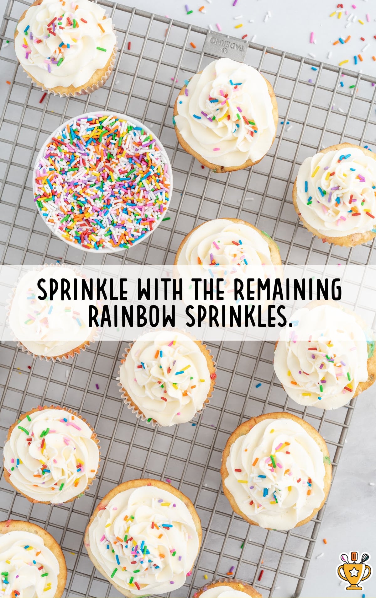 Funfetti Cupcakes on a rack with a bowl full of sprinkles