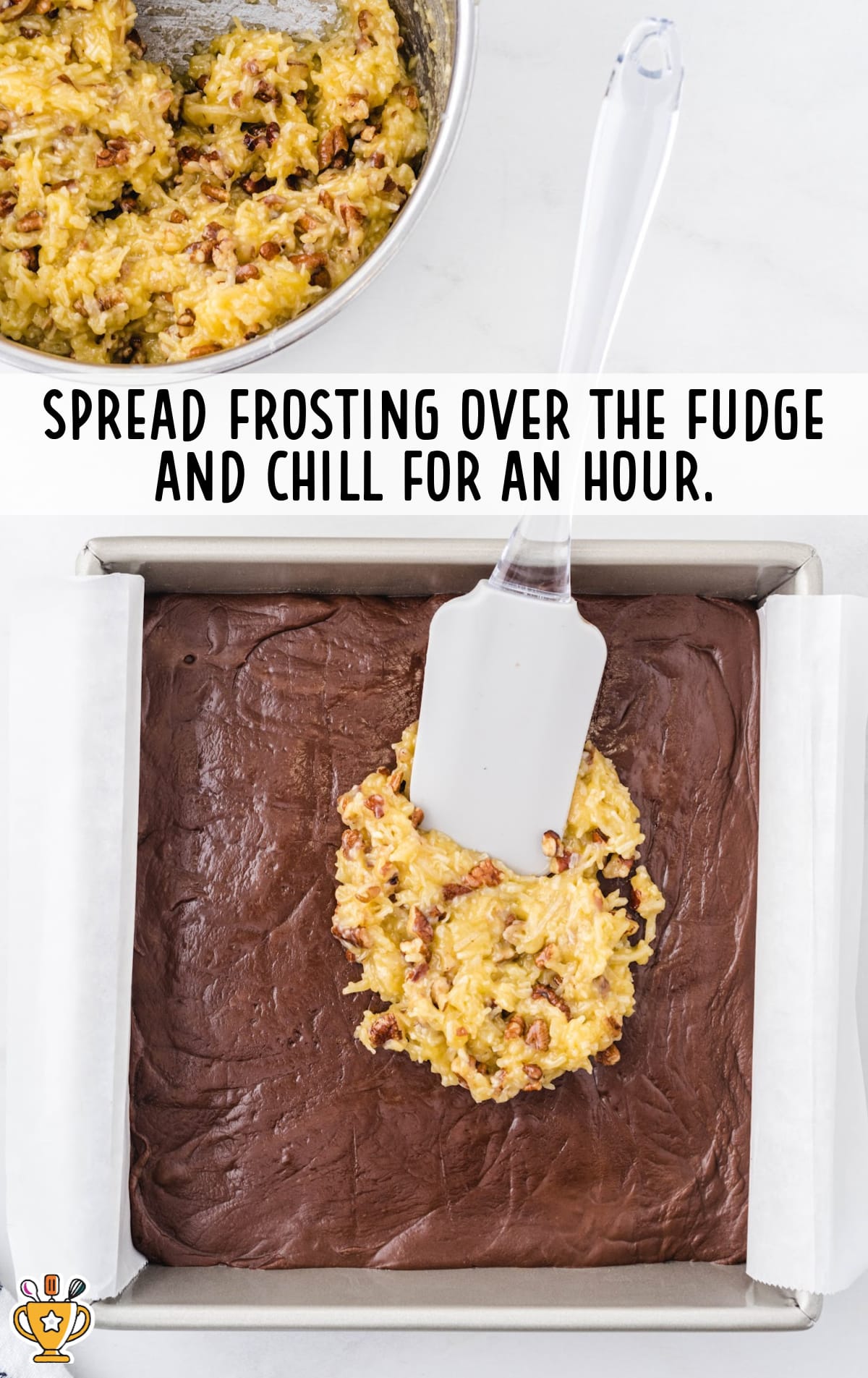 spreading frosting over the fudge