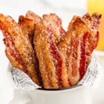 A bunch of cooked Million Dollar Bacon coated in brown sugar.