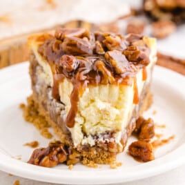 a slice of Pecan Pie Cheesecake on a plate