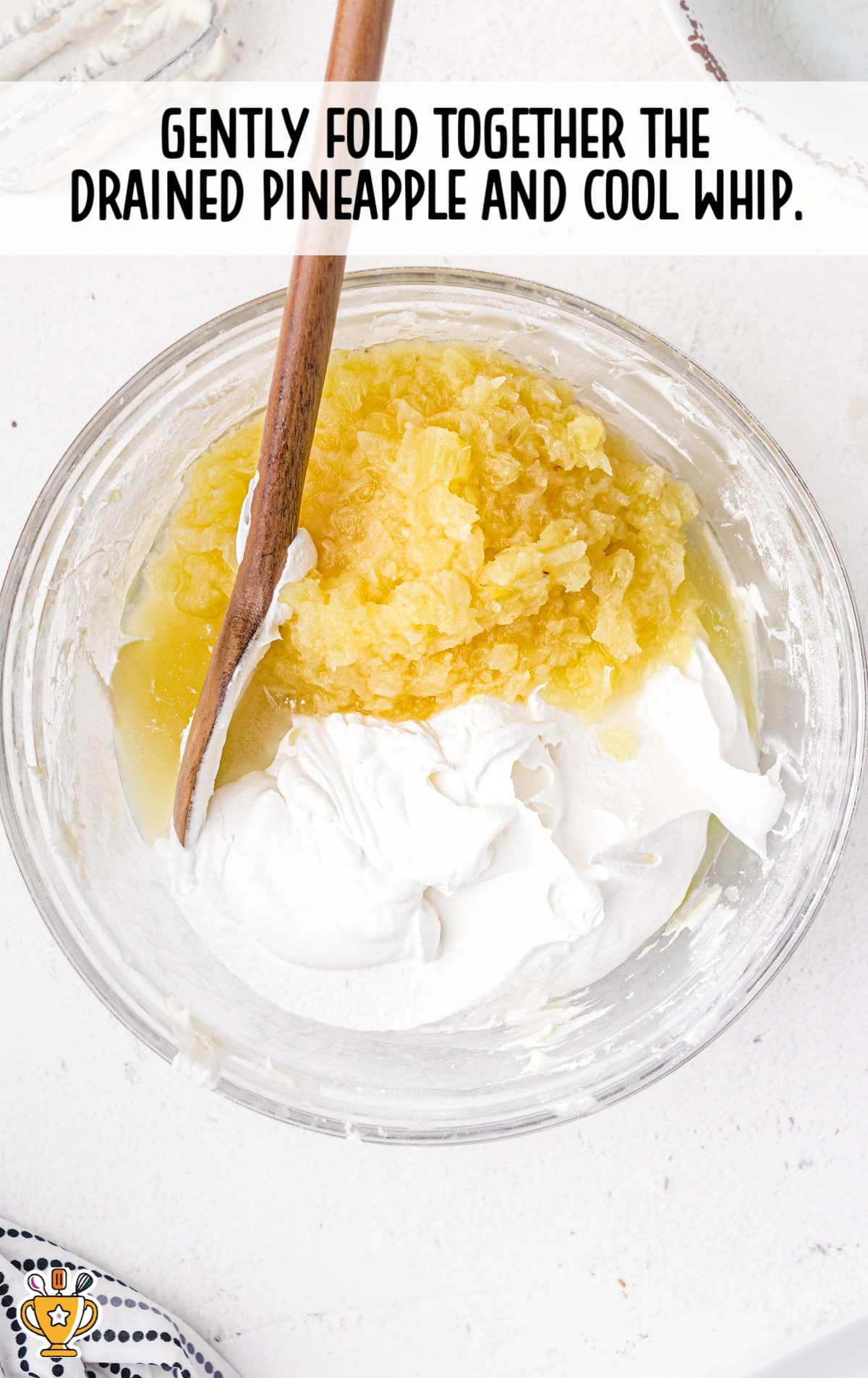 folding together the drained pineapple and cool whip