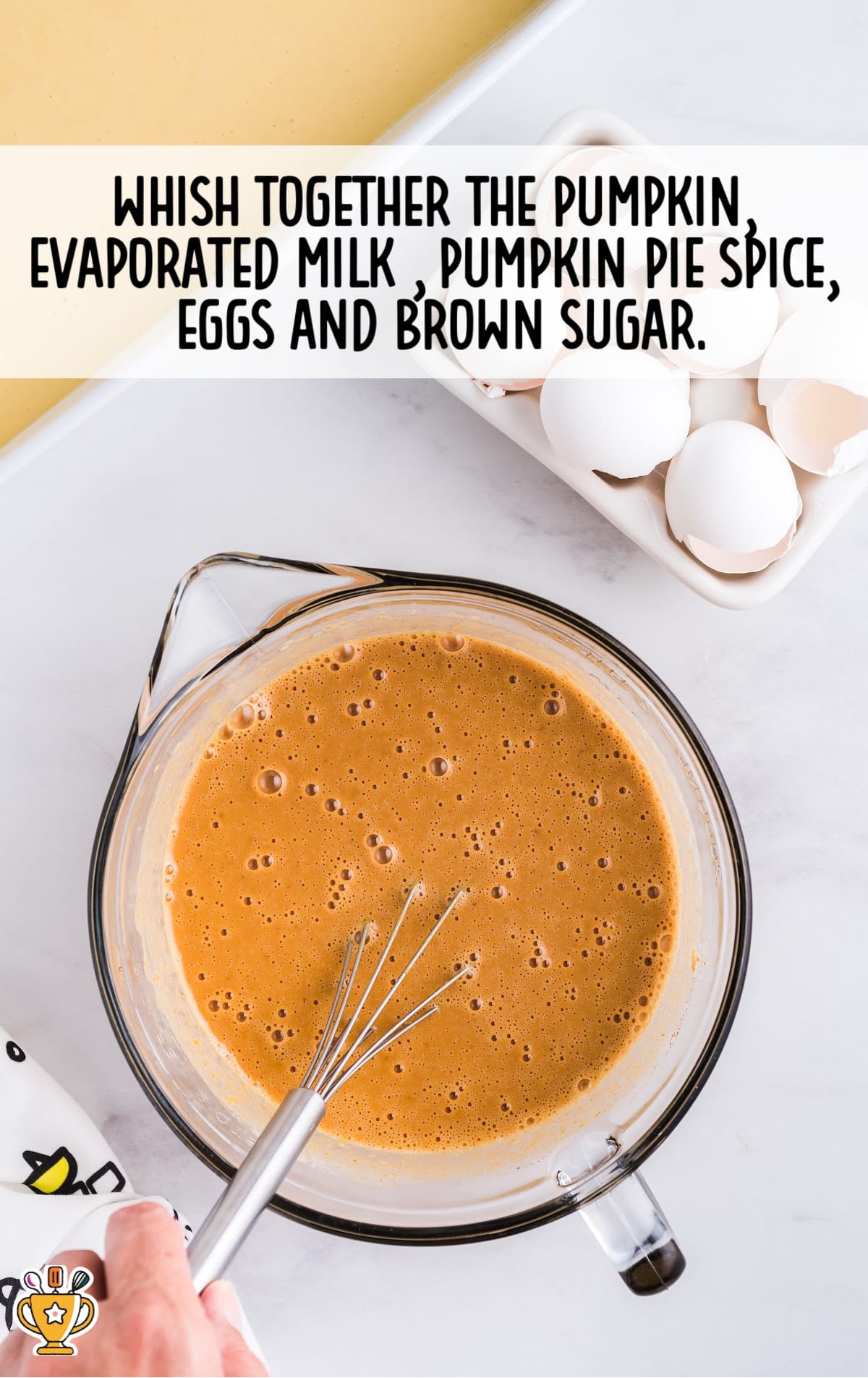 pumpkin, evaporated milk, pumpkin pie spice, eggs and brown sugar combined together in a bowl