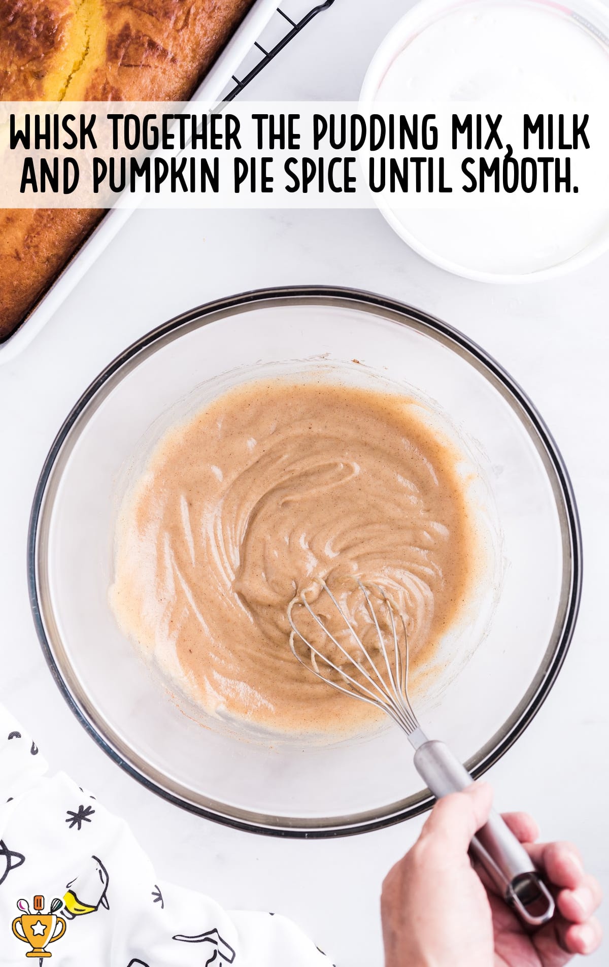 pudding mix, milk and pumpkin pie whisked together in a clear bowl