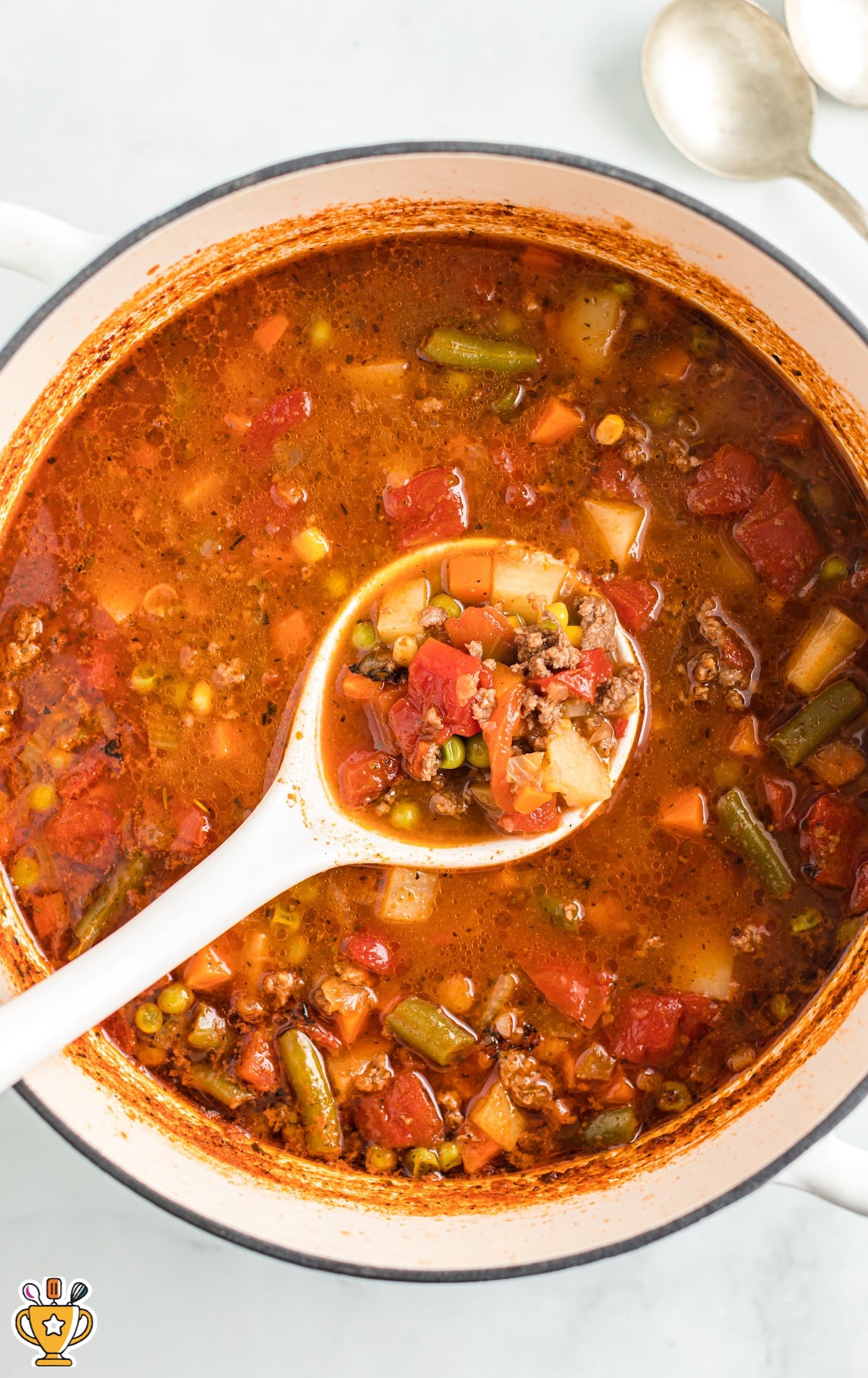 Hamburger Soup in a crockpot with a serving spoon in it