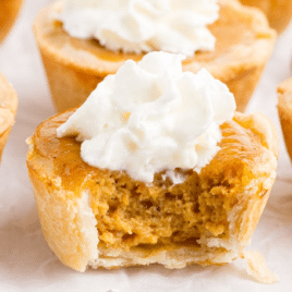 Mini Pumpkin Pies, one with a bite on it
