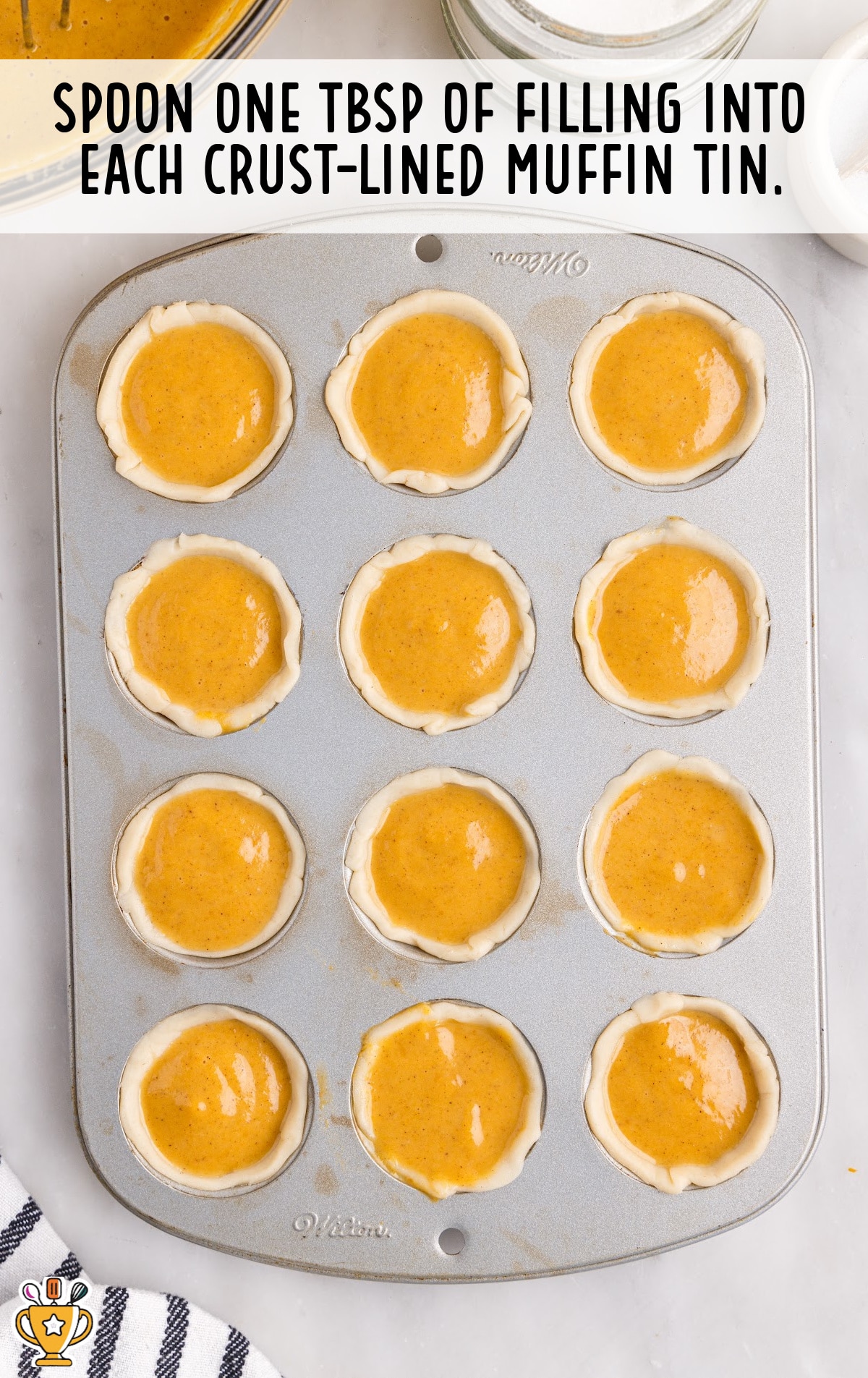 filling in crust-lined muffin tin