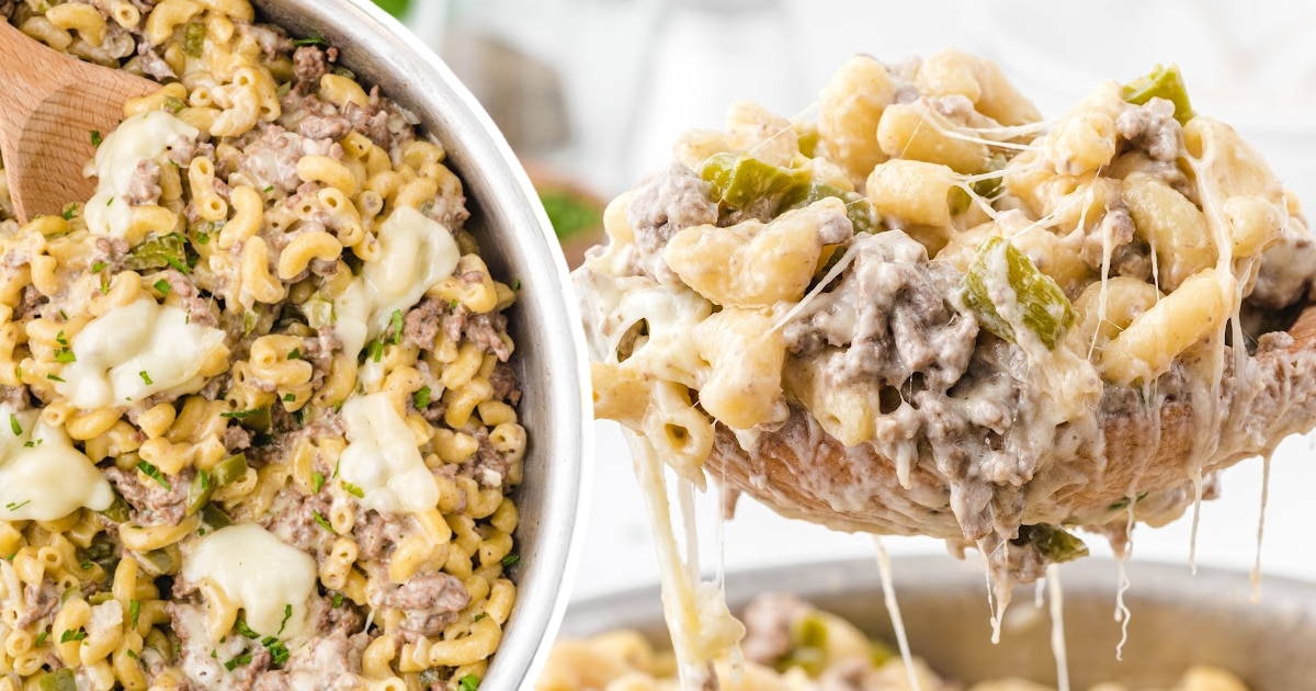 Philly Cheesesteak Pasta in a pan with a wooden spoon
