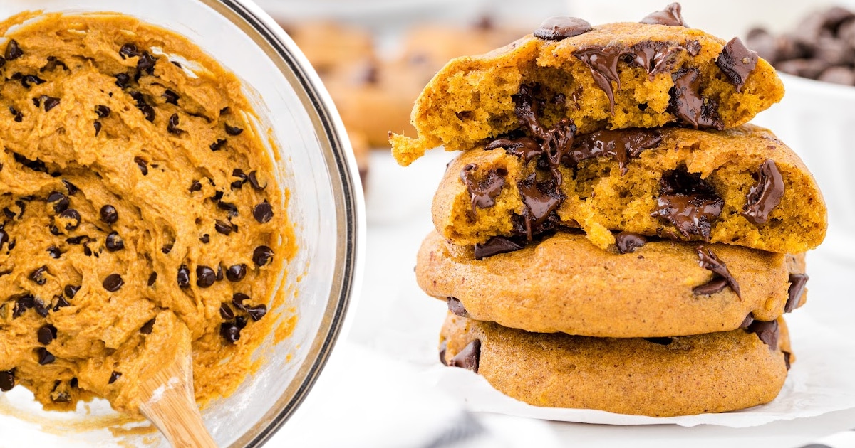 four Pumpkin Chocolate Chip Cookies stacked together with the two on top with bites on them