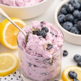 Blueberry Fluff in a mug with a spoon in it