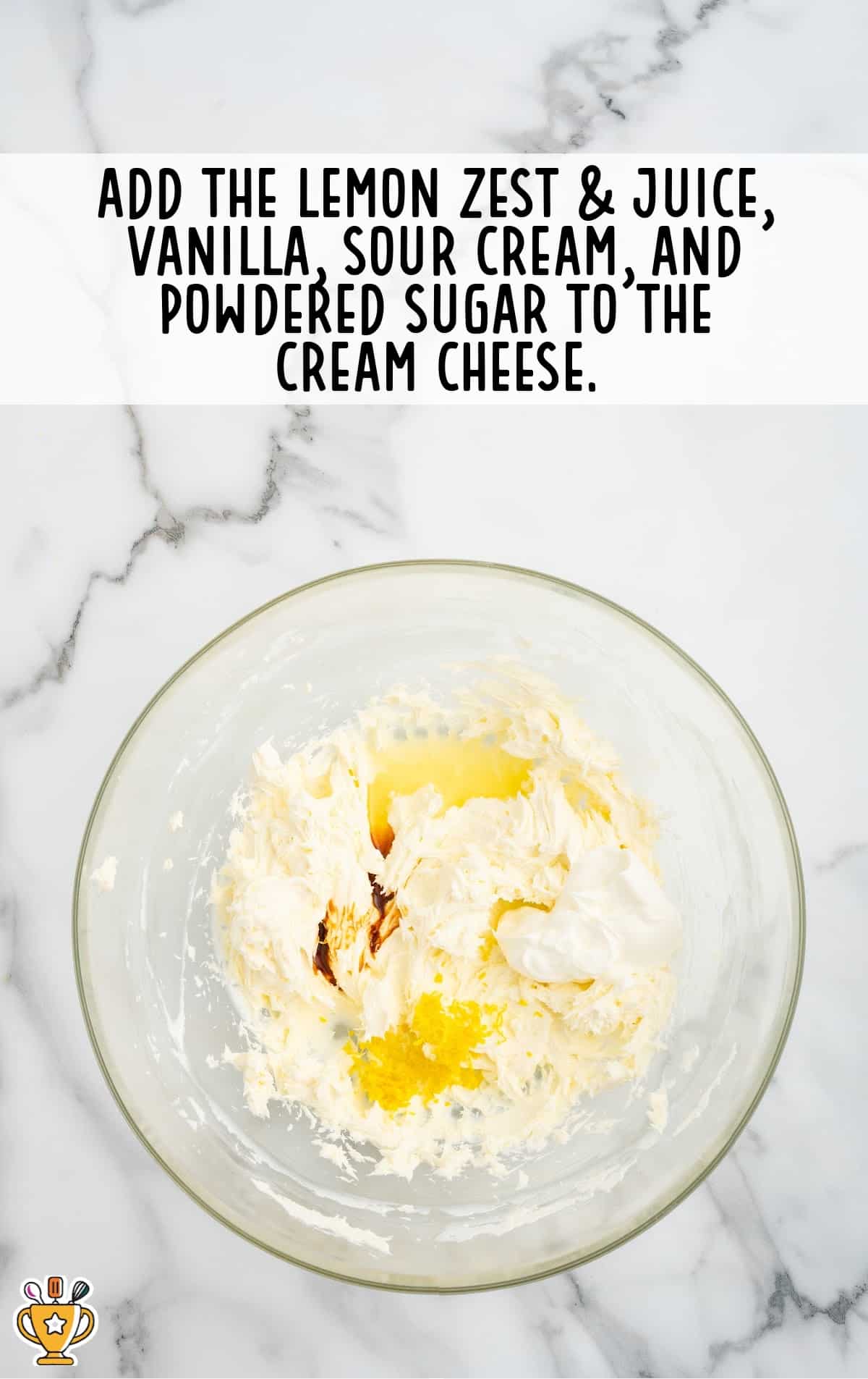 lemon zest and juice, vanilla, sour cream and powdered sugar added to the cream cheese in a bowl