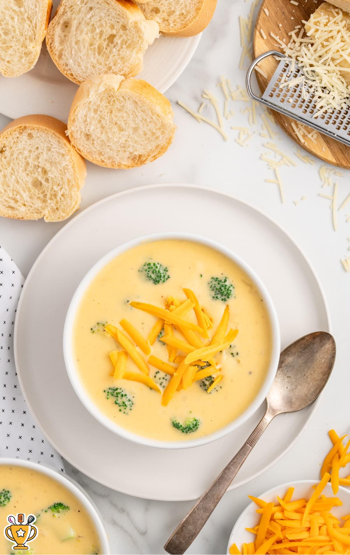 Broccoli Cheese Soup in a bowl placed on a plate