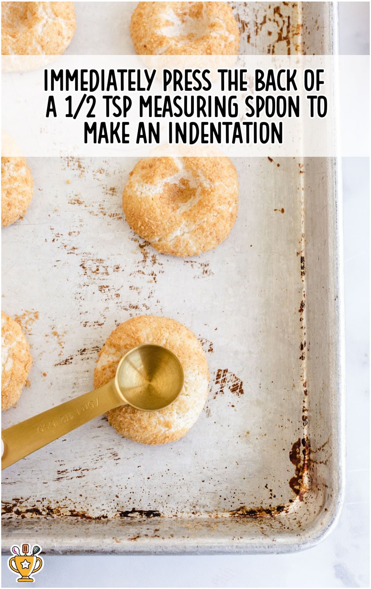pressing the Cherry Cheesecake Cookies with a ½ measuring spoon to make an indentation