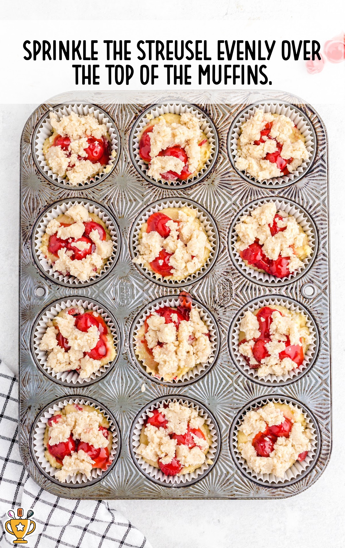 streusel sprinkled over the top of the muffins