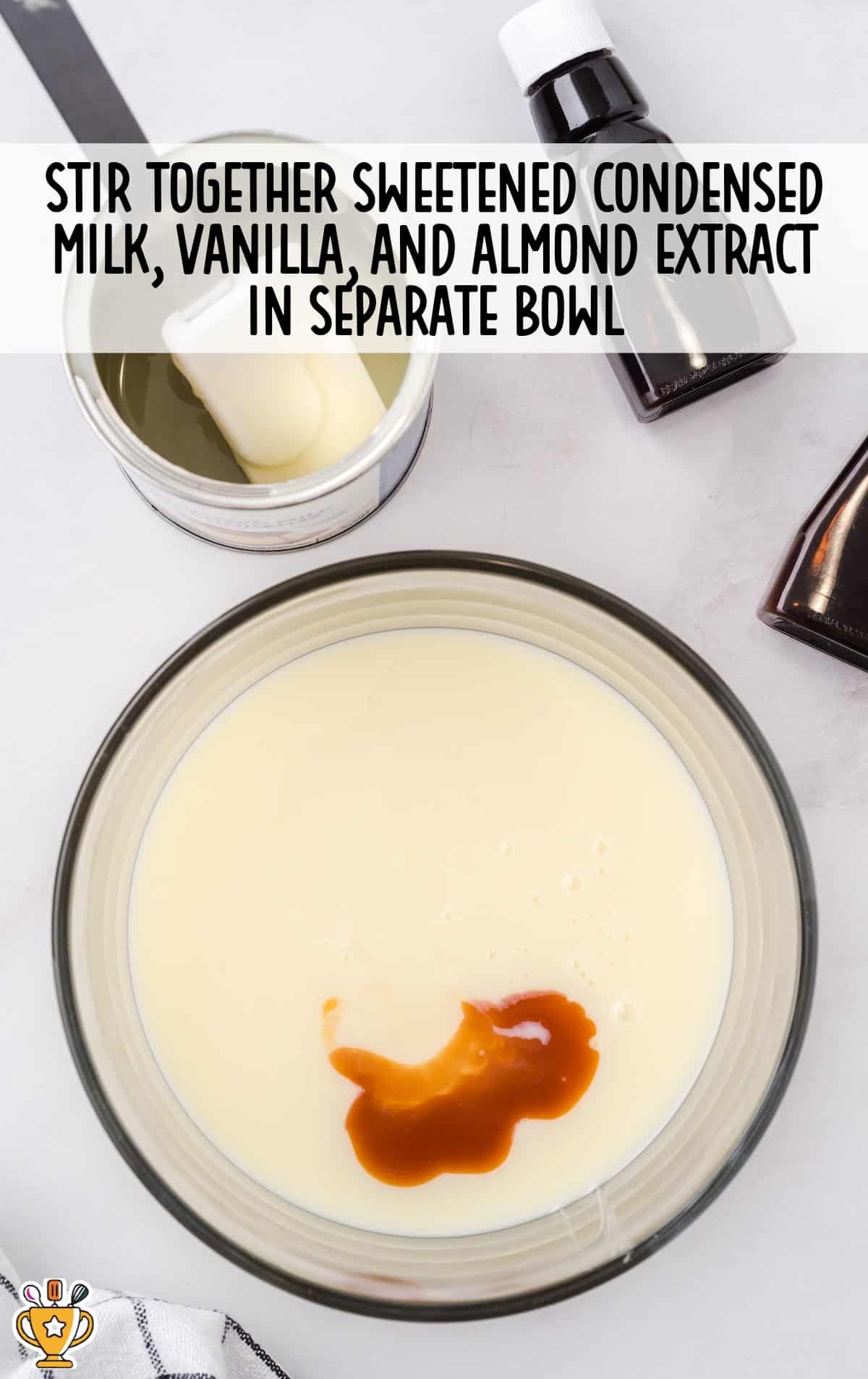 milk, vanilla and almond extract stirred together in a bowl