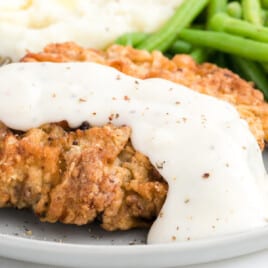 Chicken Fried Steak on a plate with a fork