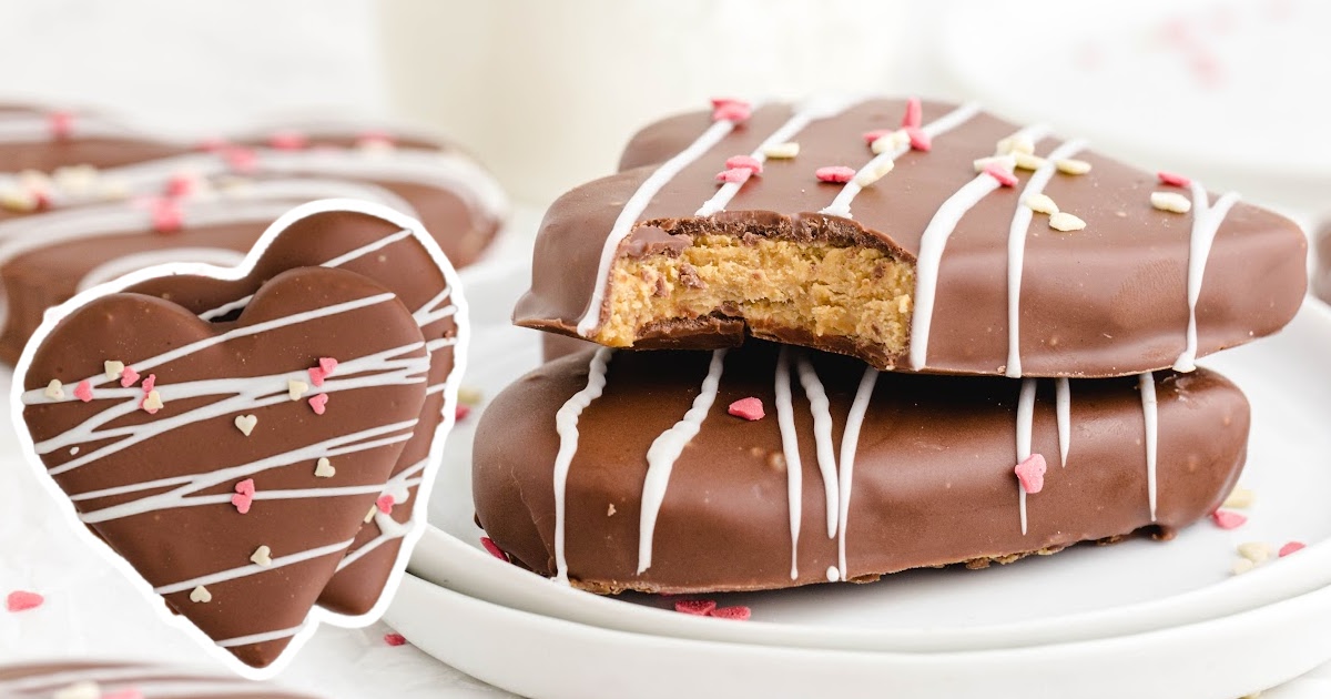 Chocolate Covered Peanut Butter Hearts on a plate, one with a bite on it