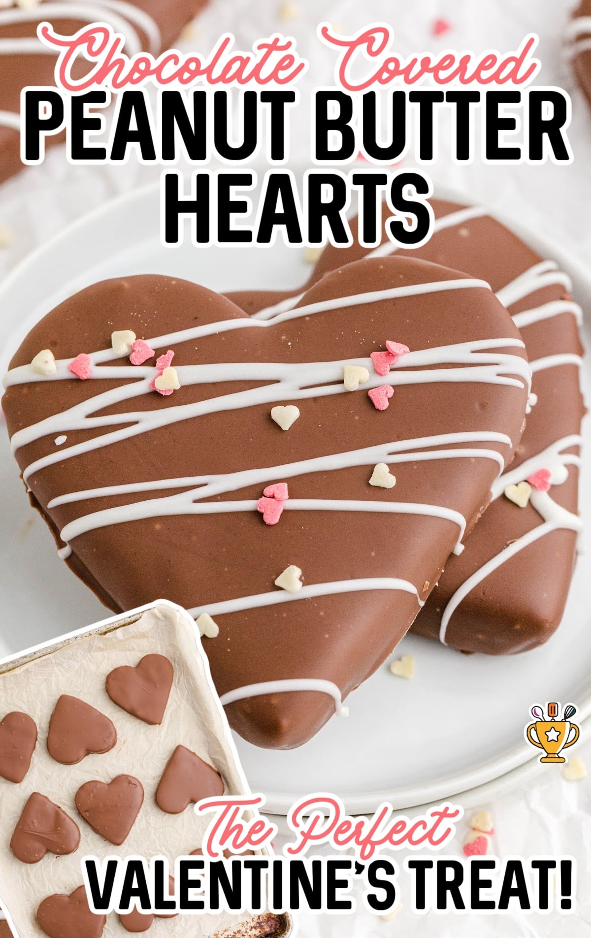 decorated Chocolate Covered Peanut Butter Hearts on a white plate