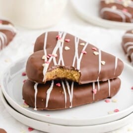 two Chocolate Covered Peanut Butter Hearts on a plate