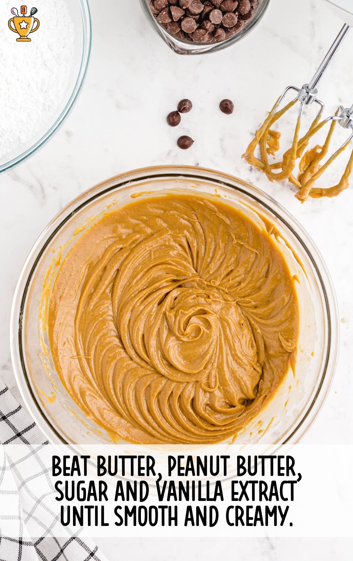 butter, peanut butter, sugar and vanilla extract mixed in a clear bowl