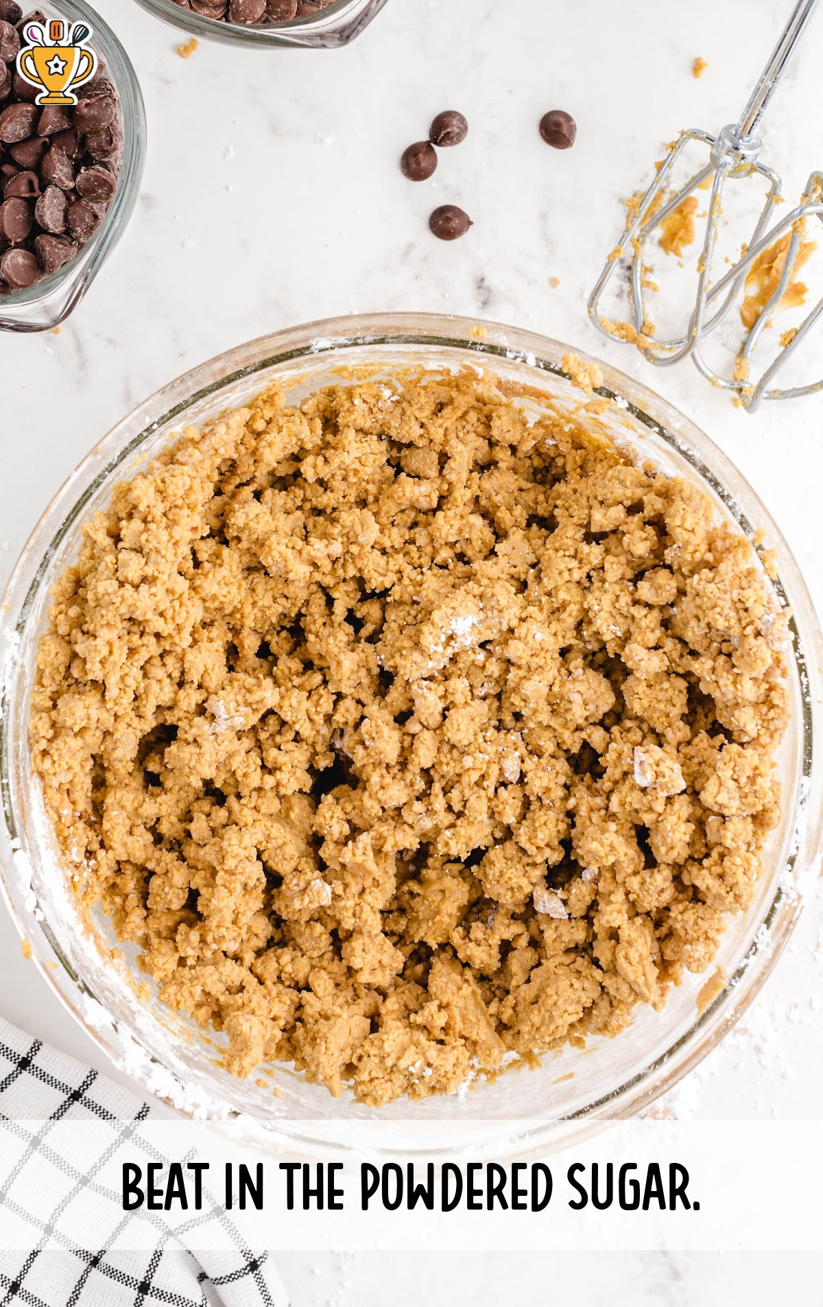 beating in the powdered sugar in a bowl