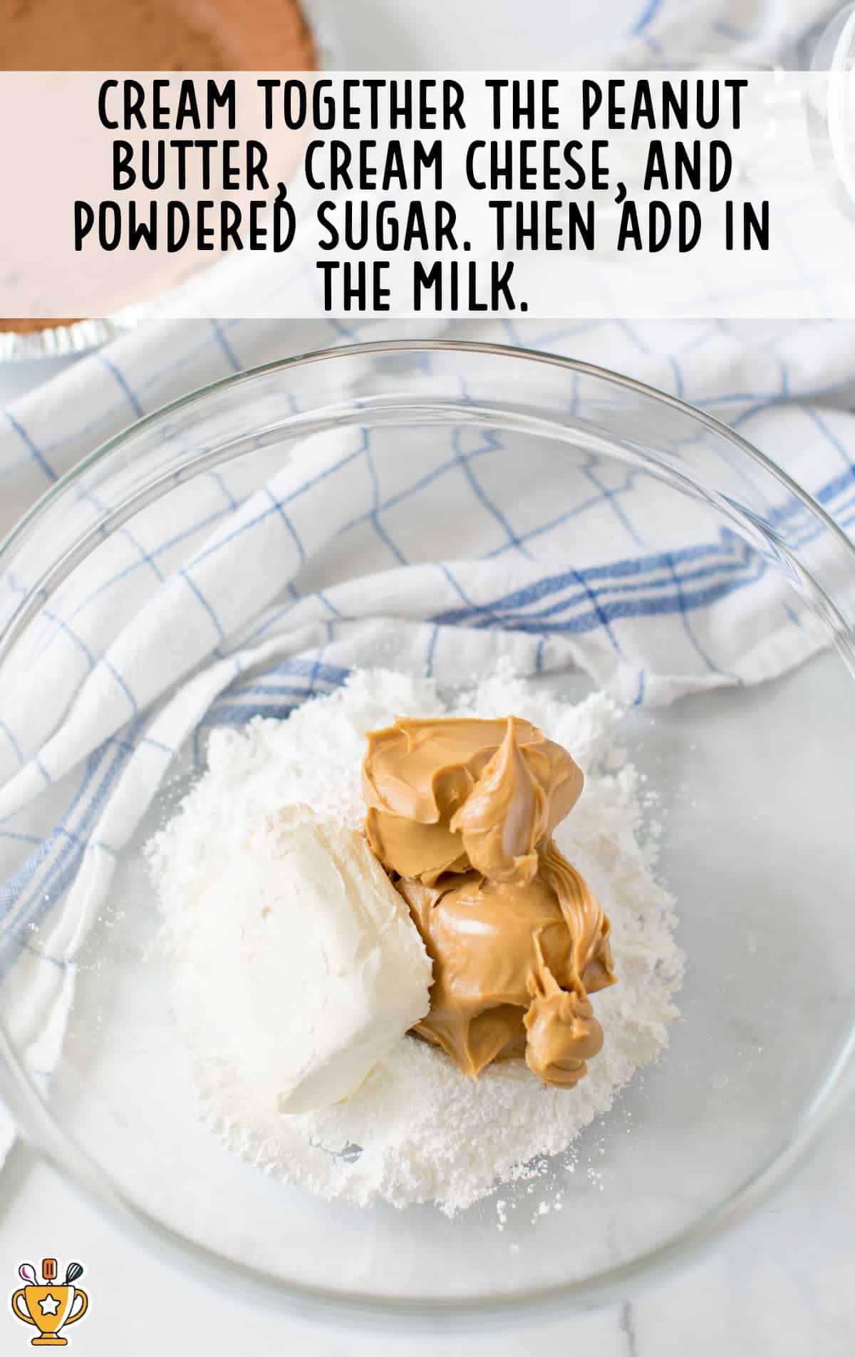 peanut butter, cream cheese and powdered sugar in a bowl