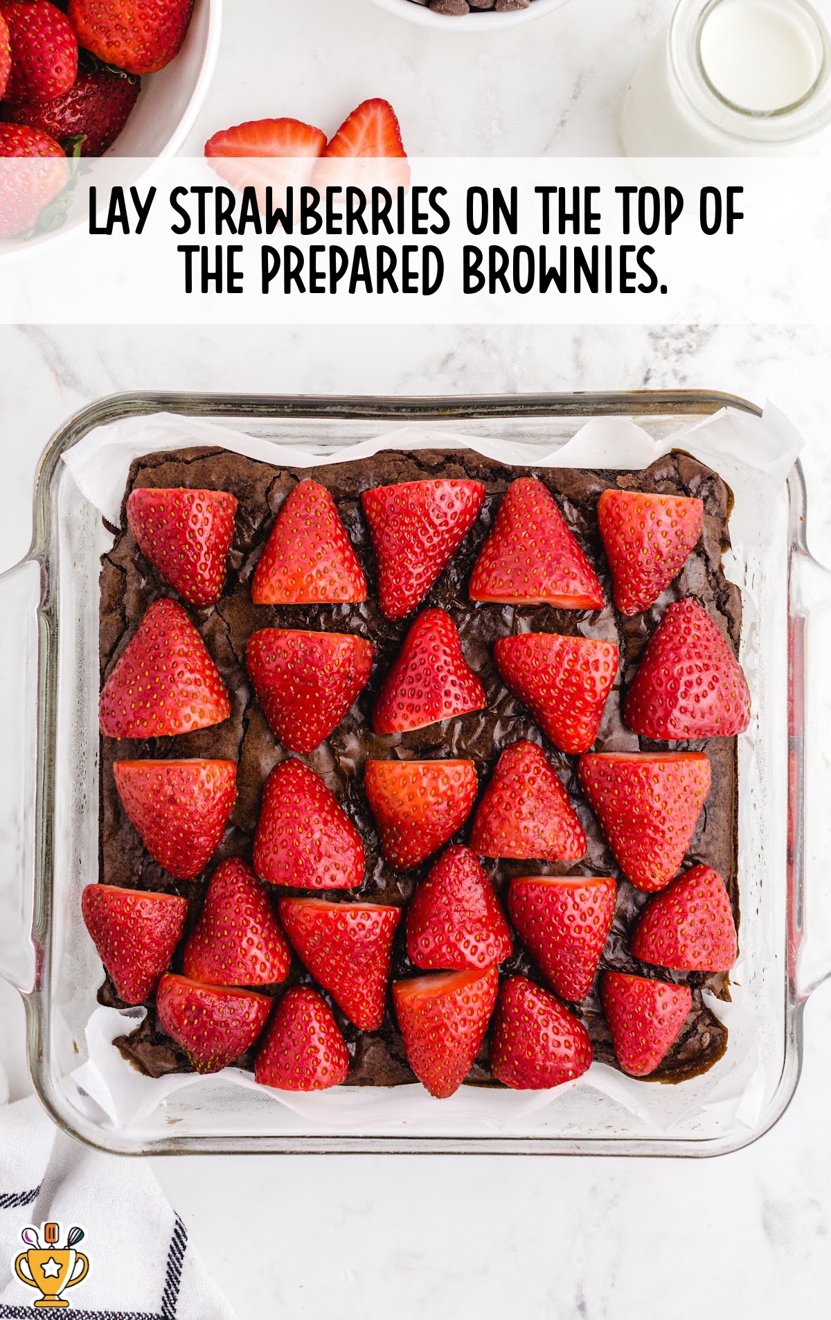 strawberries laid on top of the prepared brownies