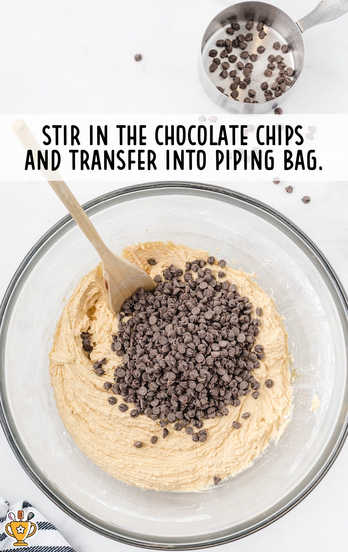 stirring in the chocolate chips in a bowl