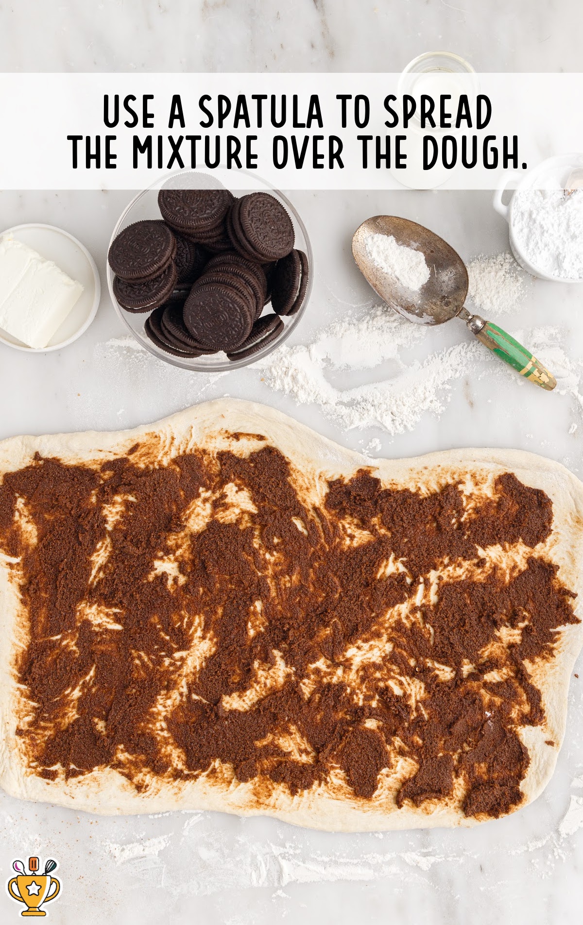 The cinnamon mixture is spread over the dough.