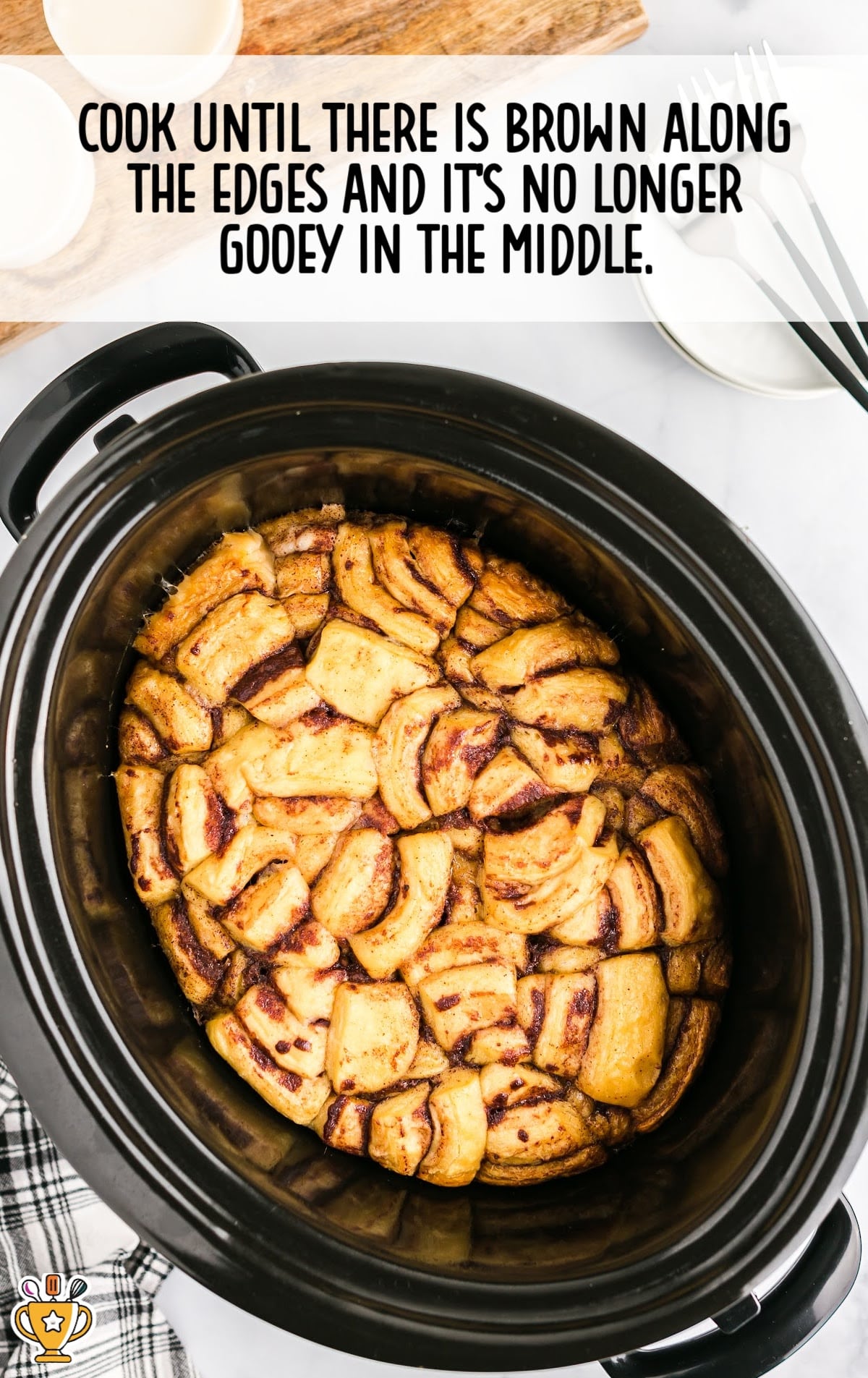 Crockpot Cinnamon Roll Casserole cooked until brown