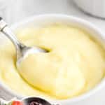 Custard in a bowl with a spoon