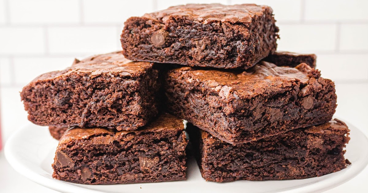 a bunch of Dr Pepper Brownies on a white plate