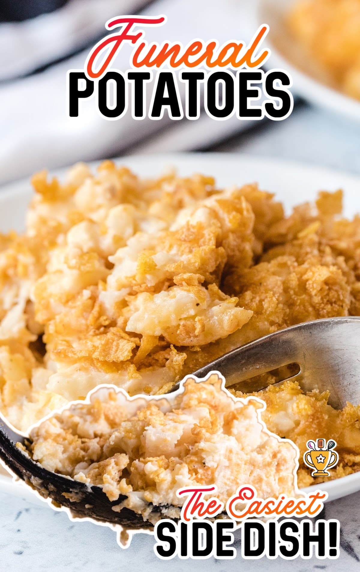Funeral Potatoes on a plate and on a black spoon