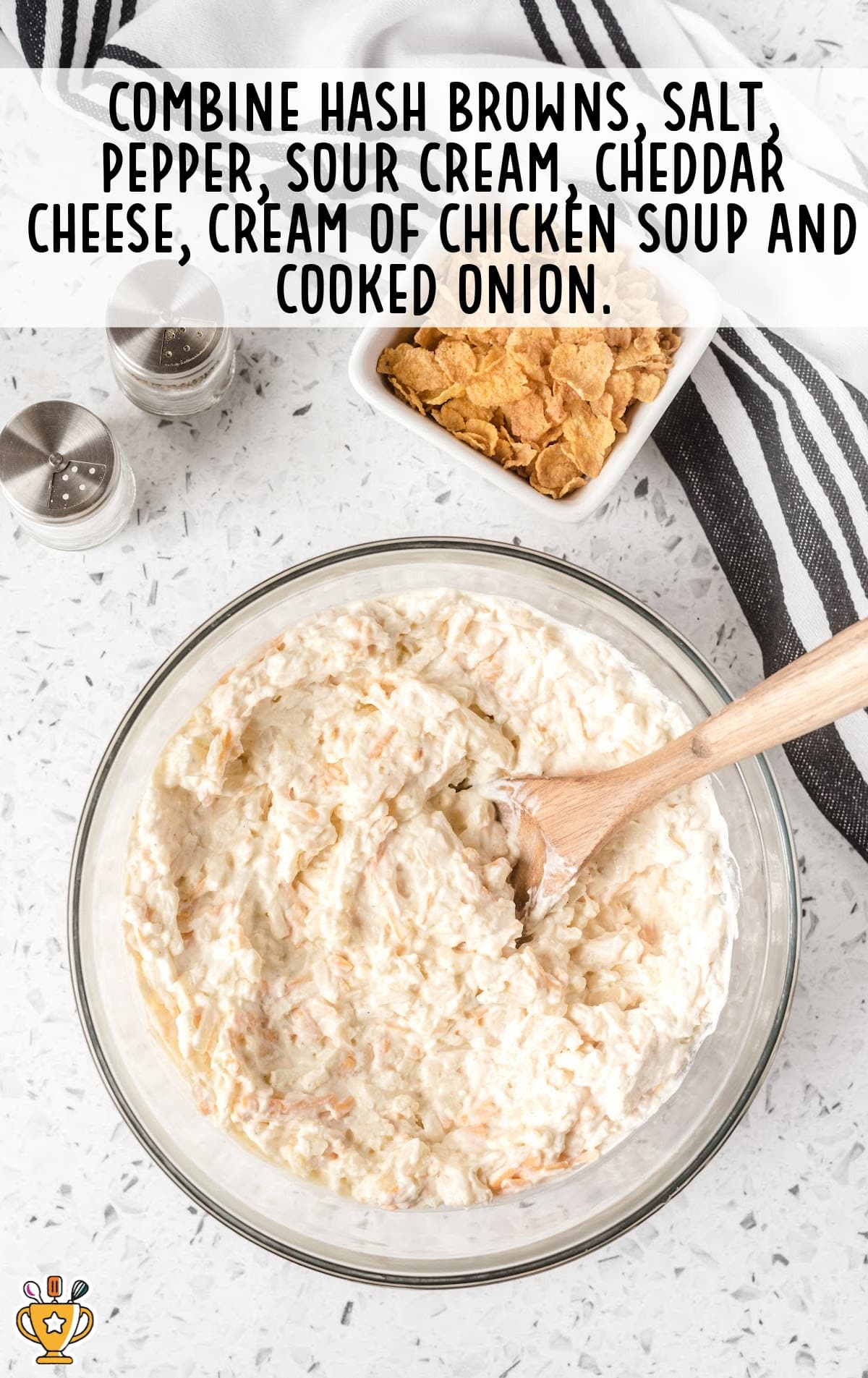 hash browns, salt, pepper, sour cream, cheddar cheese, cream of chicken soup and cooked onion combined in a bowl