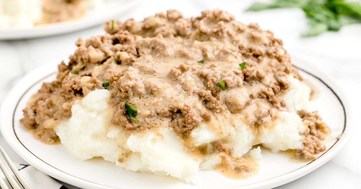 Hamburger Gravy on a plate served with mashed potatoes