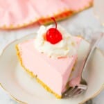 a piece of Strawberry Jello Pie on a plate with a fork