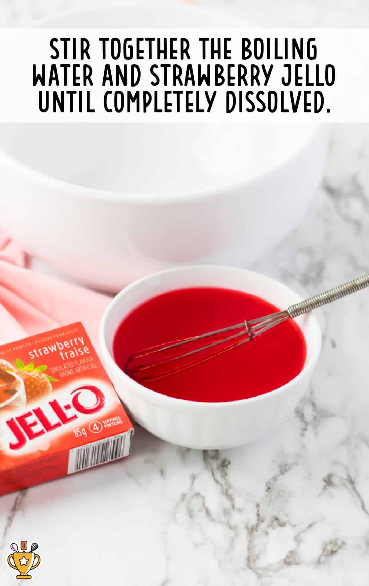 boiling water and strawberry jello whisked together