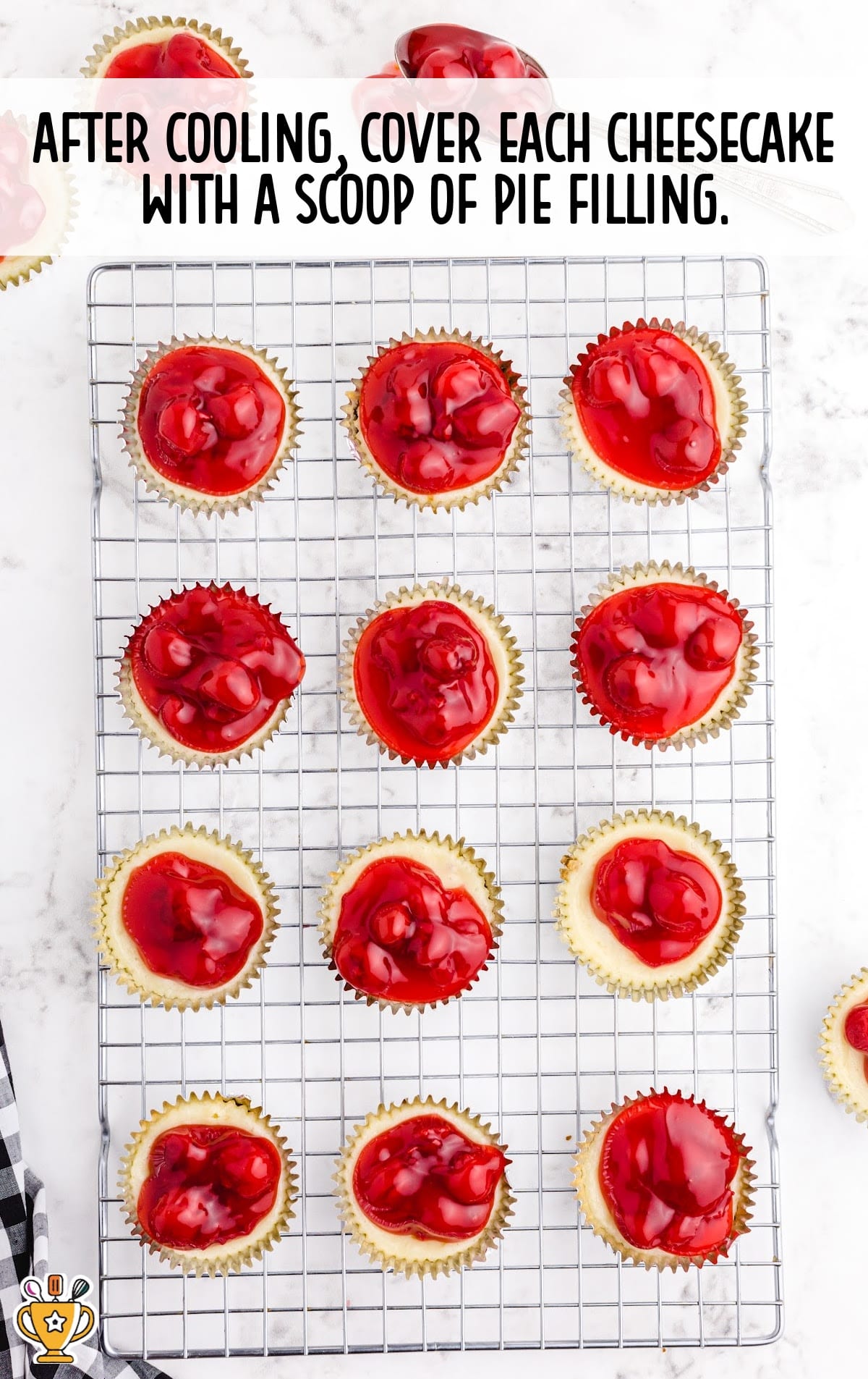 Mini Cherry Cheesecakes on a cooling rack