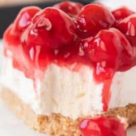 a piece No Bake Cherry Cheesecake on a plate
