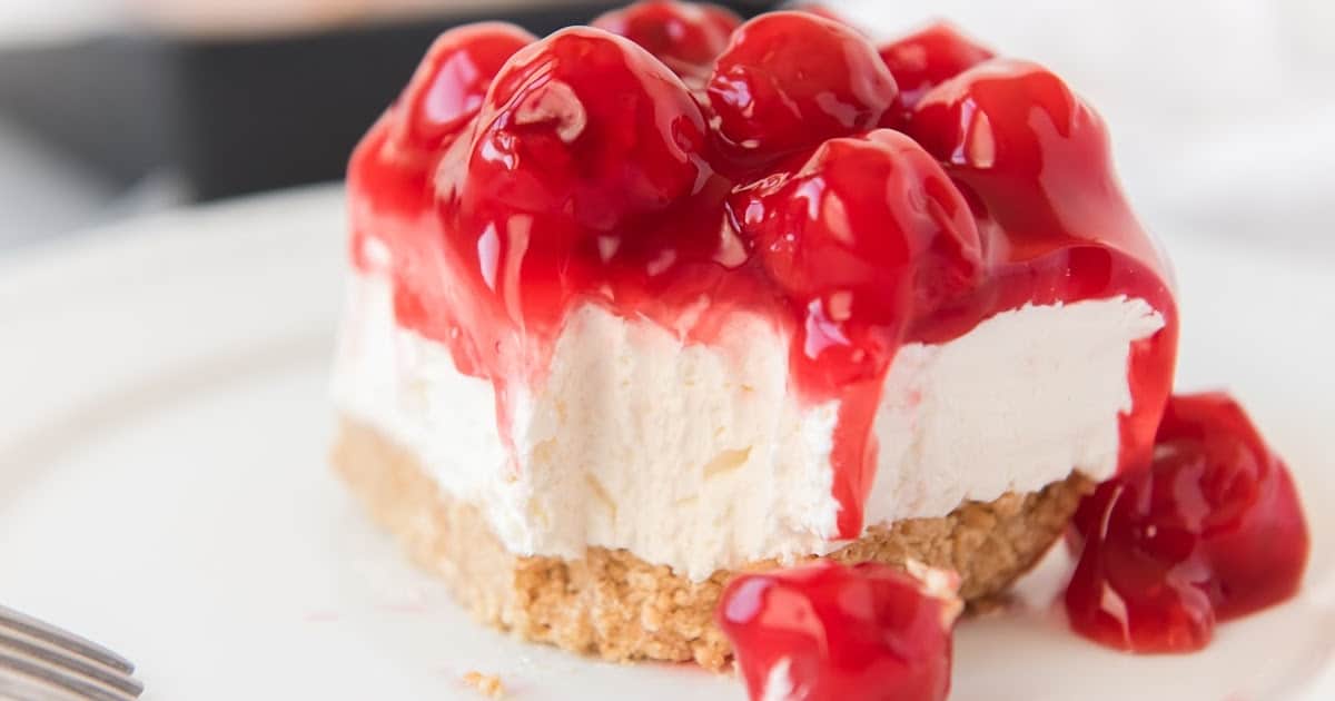 a piece of No Bake Cherry Cheesecake on a plate