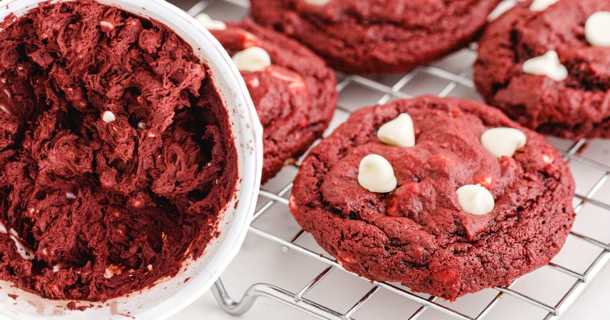 Red Velvet Cookies on a cooling rack and some butter in a bowl