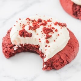 a Red Velvet Cream Cheese Cookie with a bite on it